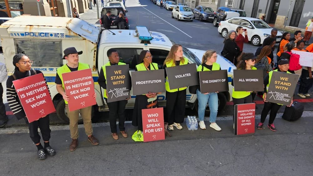 Protestors holding signs